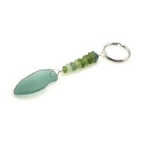 teal pendant with tiny sea glass accents in shades of green